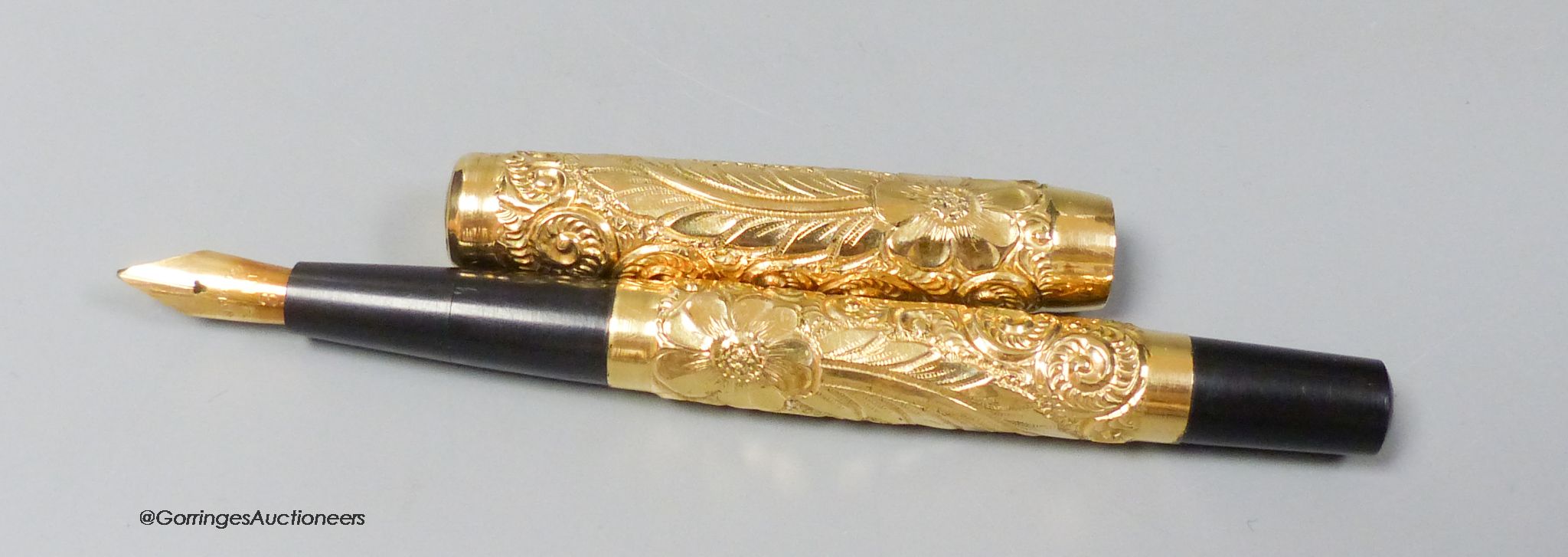 A 1920's gold plated eye-dropper fountain pen